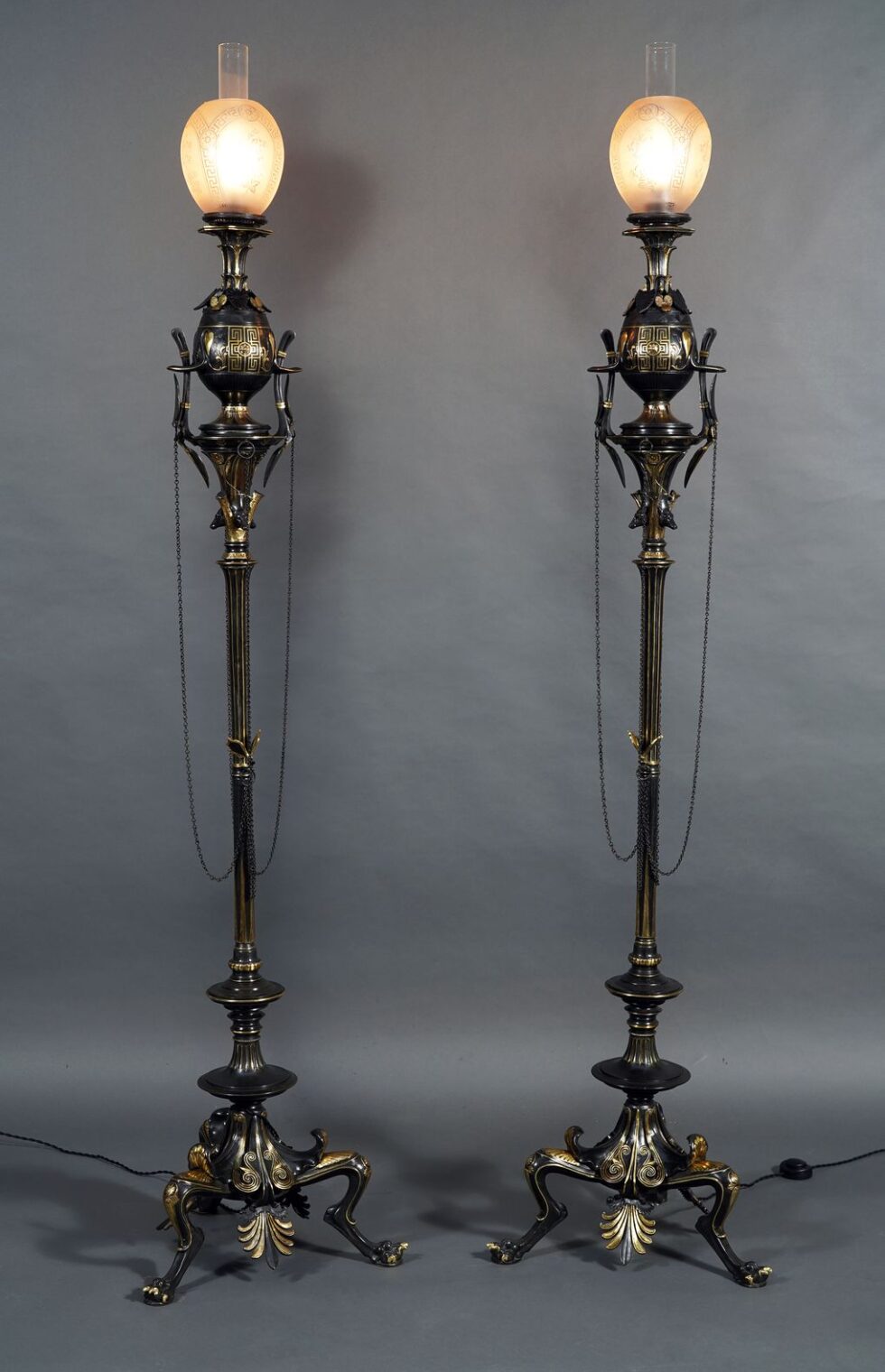 G. Servant<br />Pair of neo-Greek floor lamps