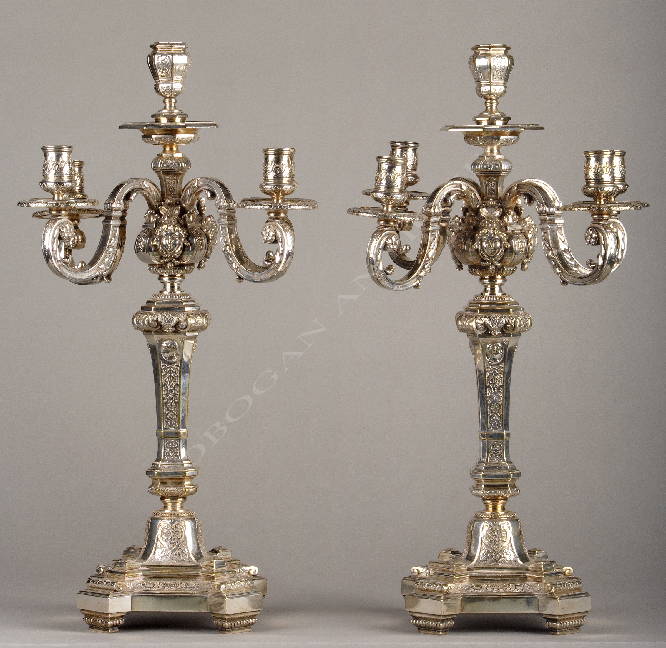 Pair of candelabras with feminine masks