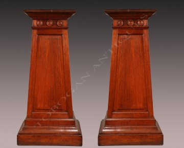 A Large Pair of Greek Revival Stands
